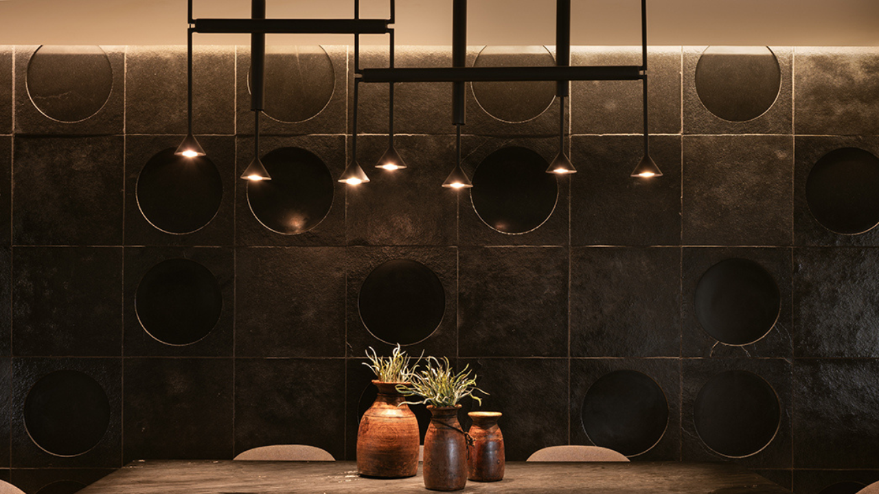 Designmint circular metal wall art in a contemporary dining room
